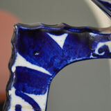 White hand-painted ceramic vase with blue patterns