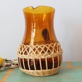Amber glass decanter dressed in wicker, vintage