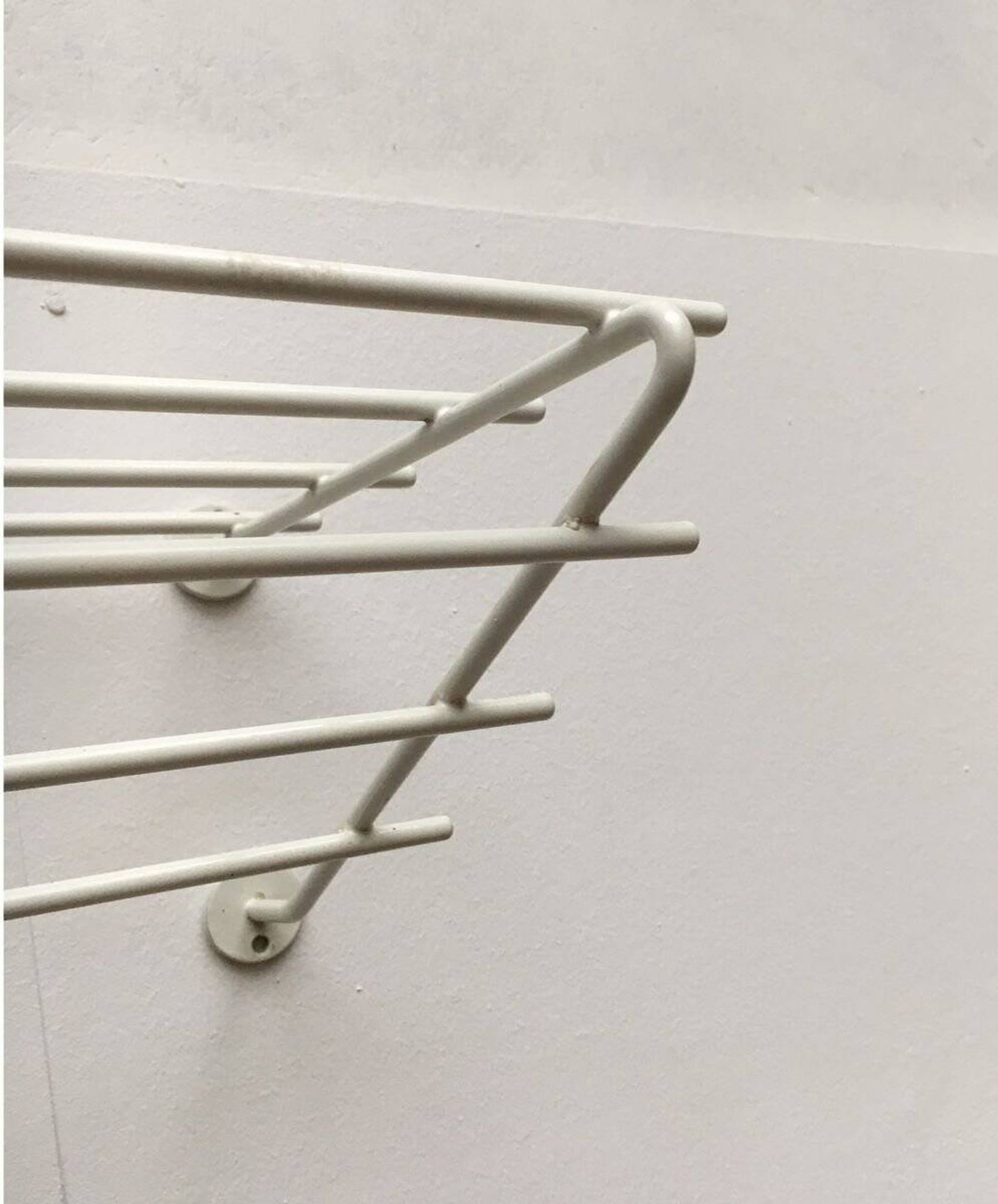Mid-century modern minimalist metal coat rack from the 1960s.