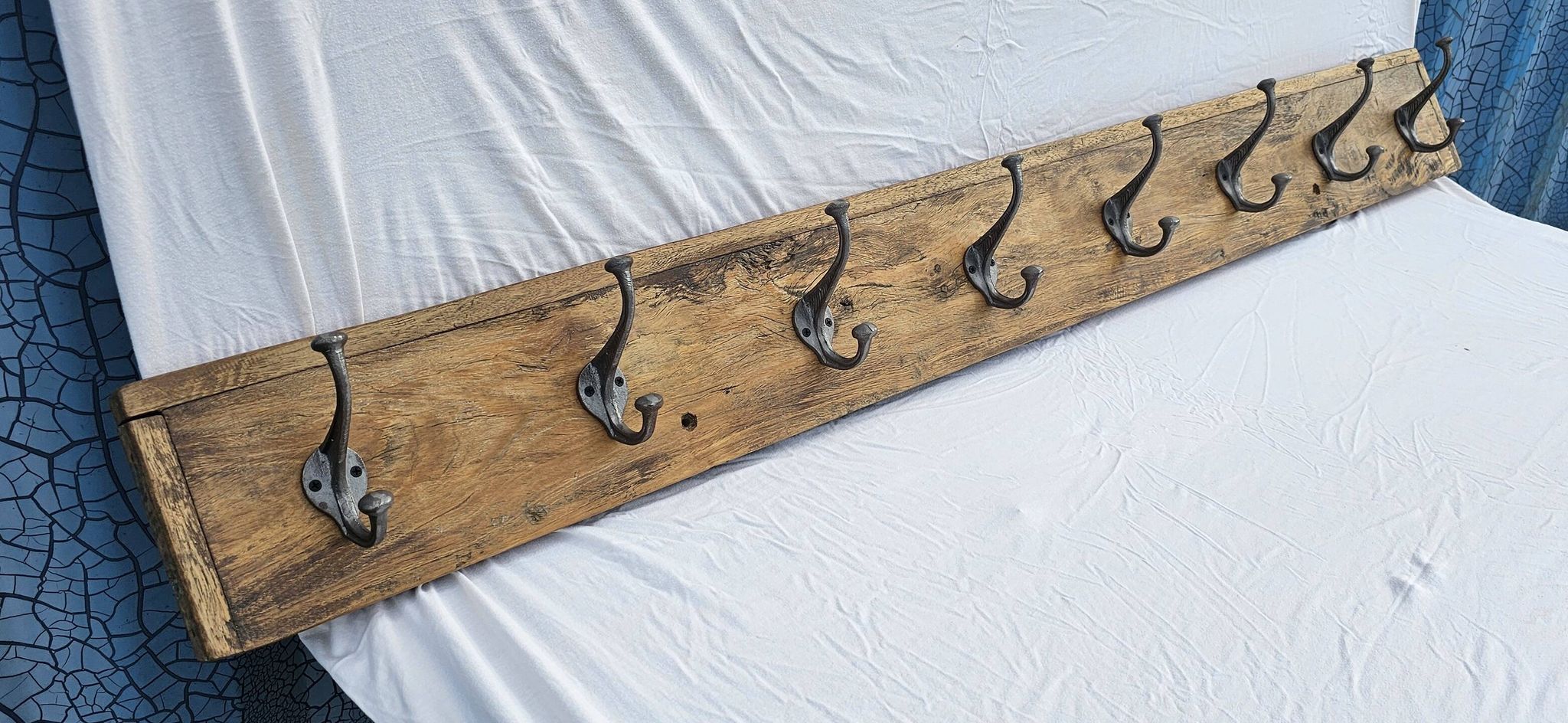 Teak coat rack with 8 double cast iron hooks