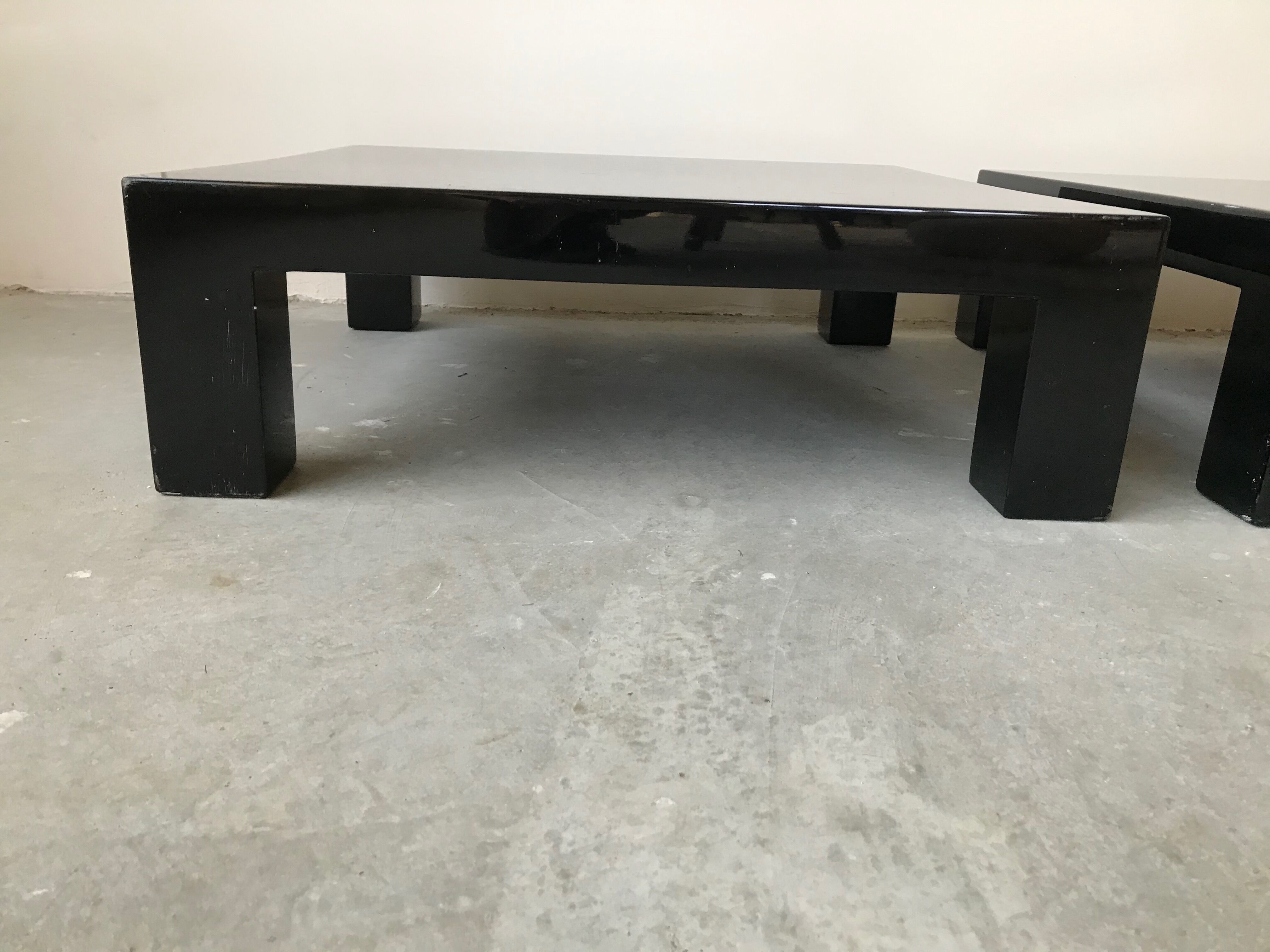 Pair of black laqué wood coffee tables, circa 1970.