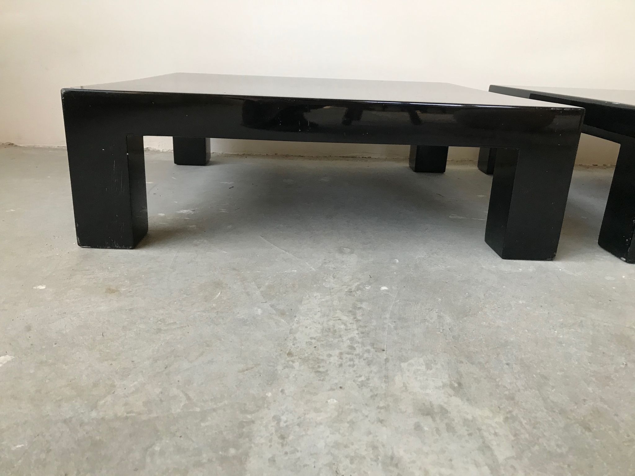 Pair of black laqué wood coffee tables, circa 1970.
