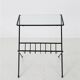 Filigree mid-century modern side table with magazine rack / steel / glass / 1960s