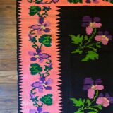 Oltenian floral rug handwoven in wool, purple flowers on black and pink background