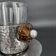 Duo of hammered metal and blown glass cups — handcrafted work