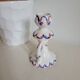 Ceramic candlestick with red and blue decoration.
