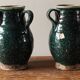 Set of two Chinese green glazed stoneware storage jars.
