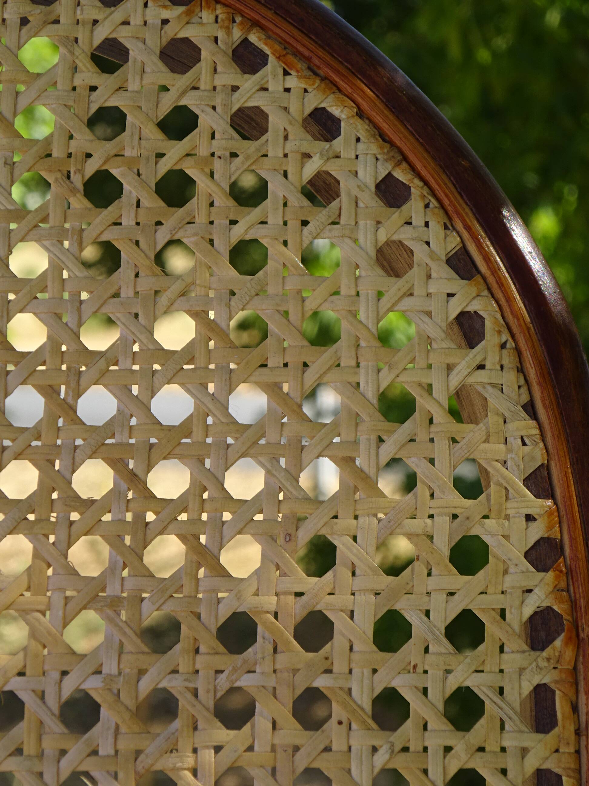 Vintage wooden rocking chair with caning