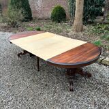 Large oval mahogany dining table from the 19th century Restoration period