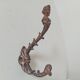 Antique wall coat hook from the 19th century in Victorian cast iron style.