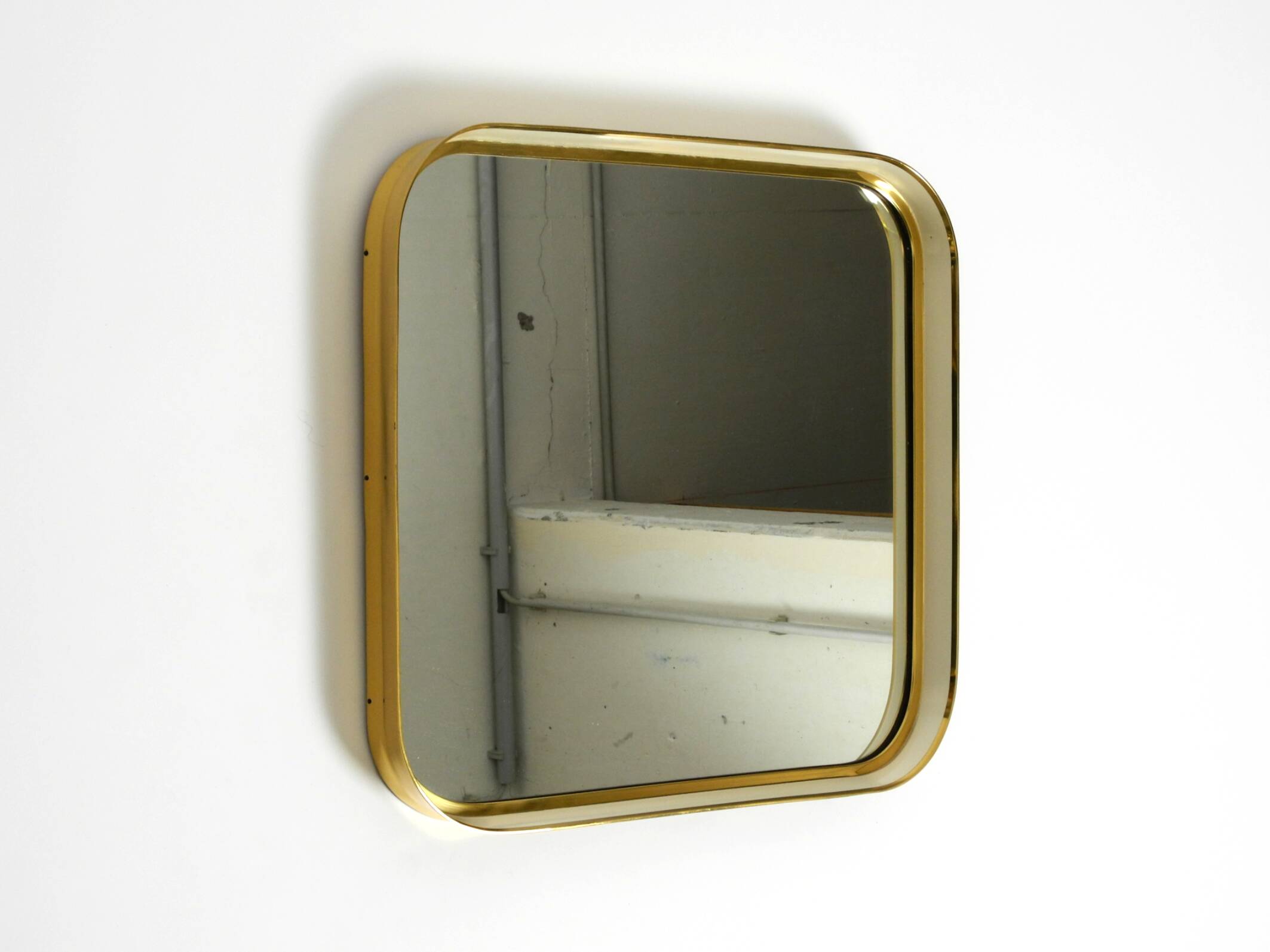 Beautiful original Mid Century Modern "Zier-Form" wall mirror with heavy br
