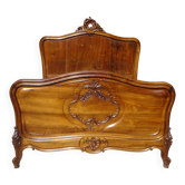 Antique Louis XV bed made of solid walnut.