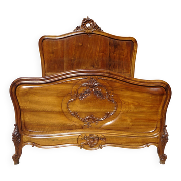 Antique Louis XV bed made of solid walnut.