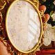 2 frames in gilded metal and curved glass