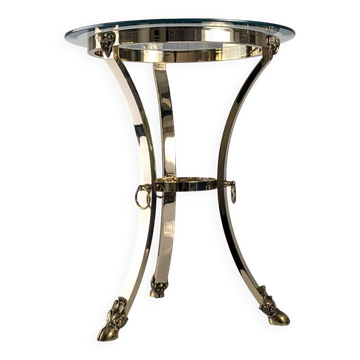 Neoclassical side table in brass and bevelled glass with ram's heads, 1970s.