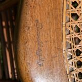 Old baby high chair in wood and canework