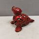 Beautiful seal in ceramic with metallic red glaze.
