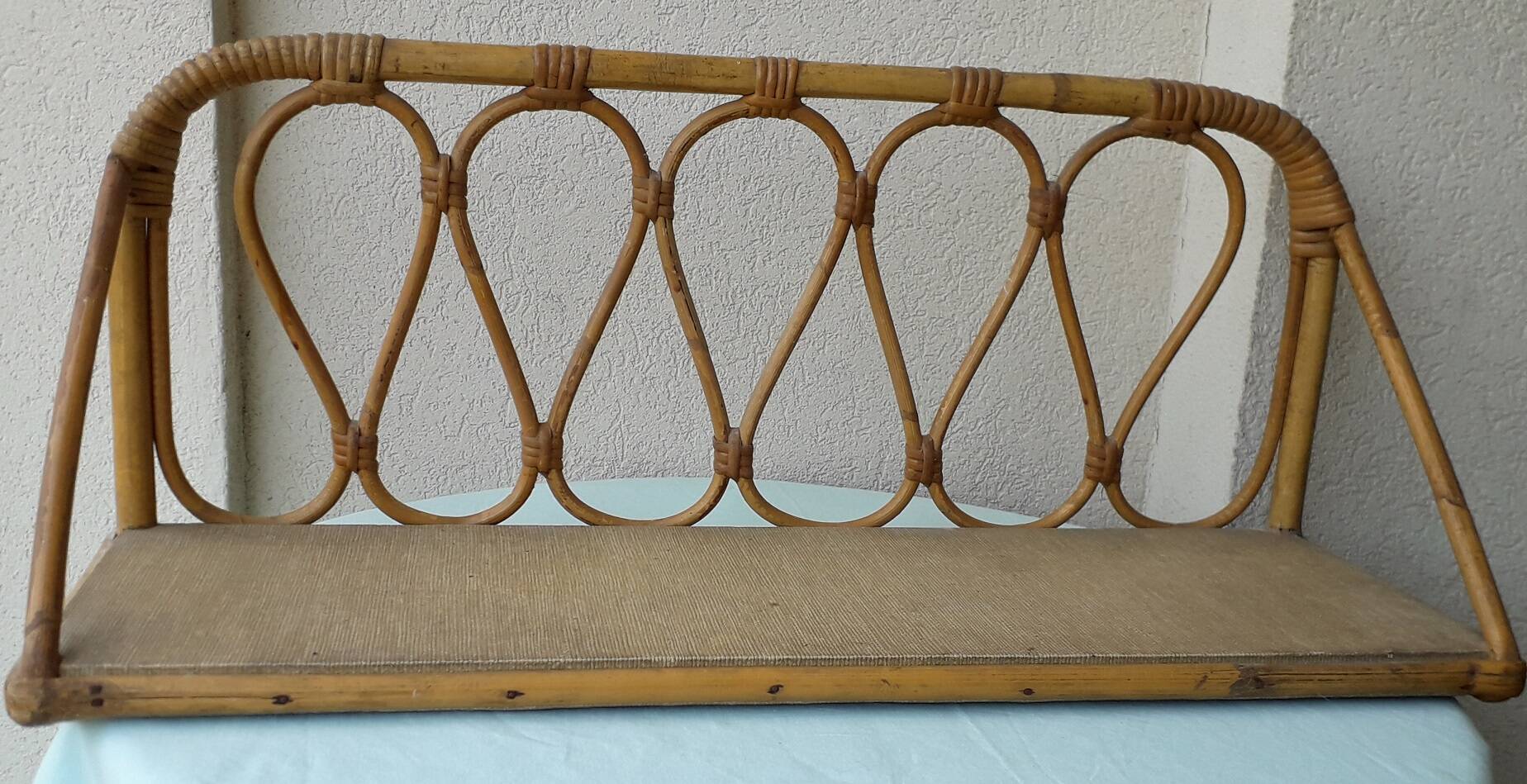 Rattan wall shelf