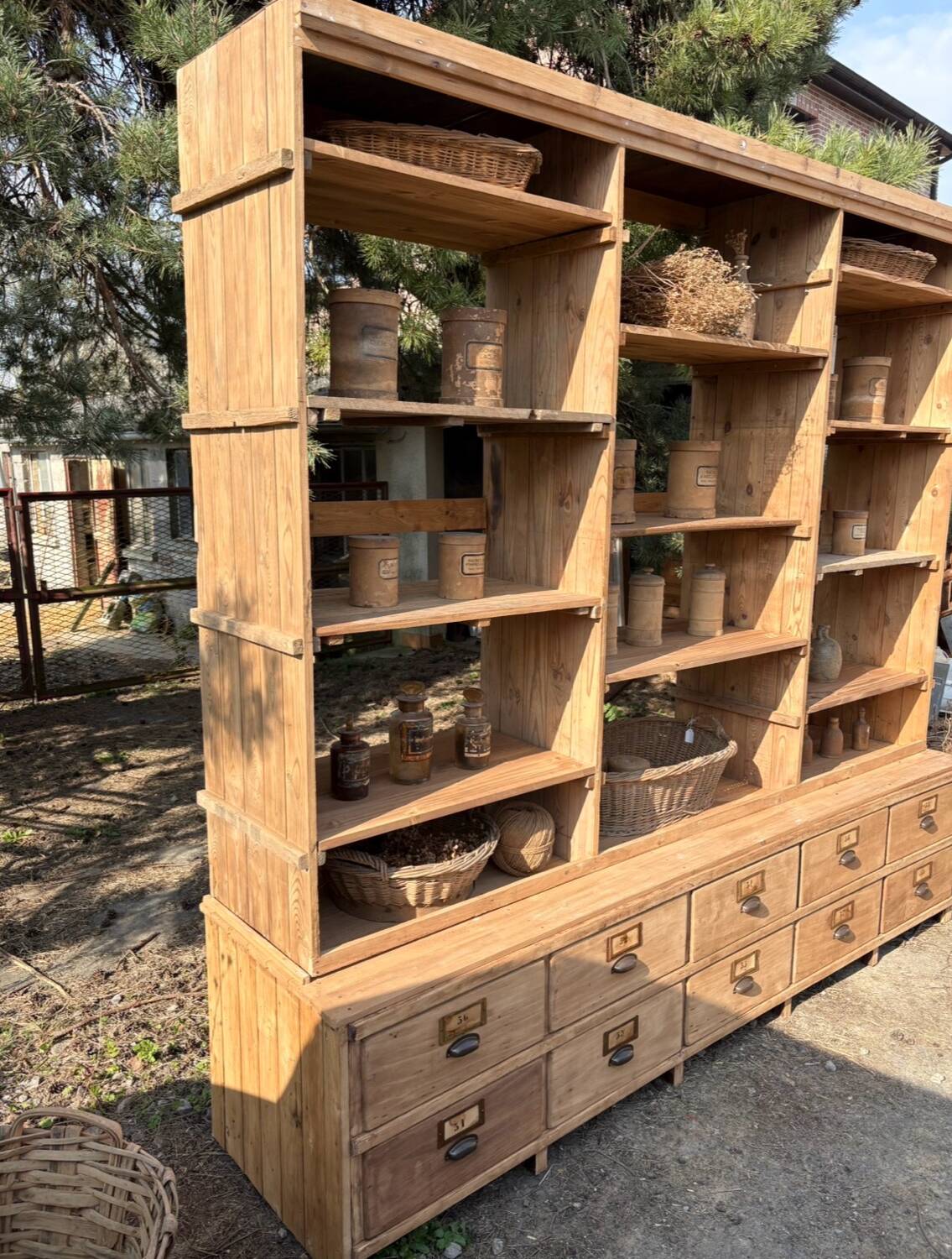 Large antique workshop furniture with drawers and shelves.