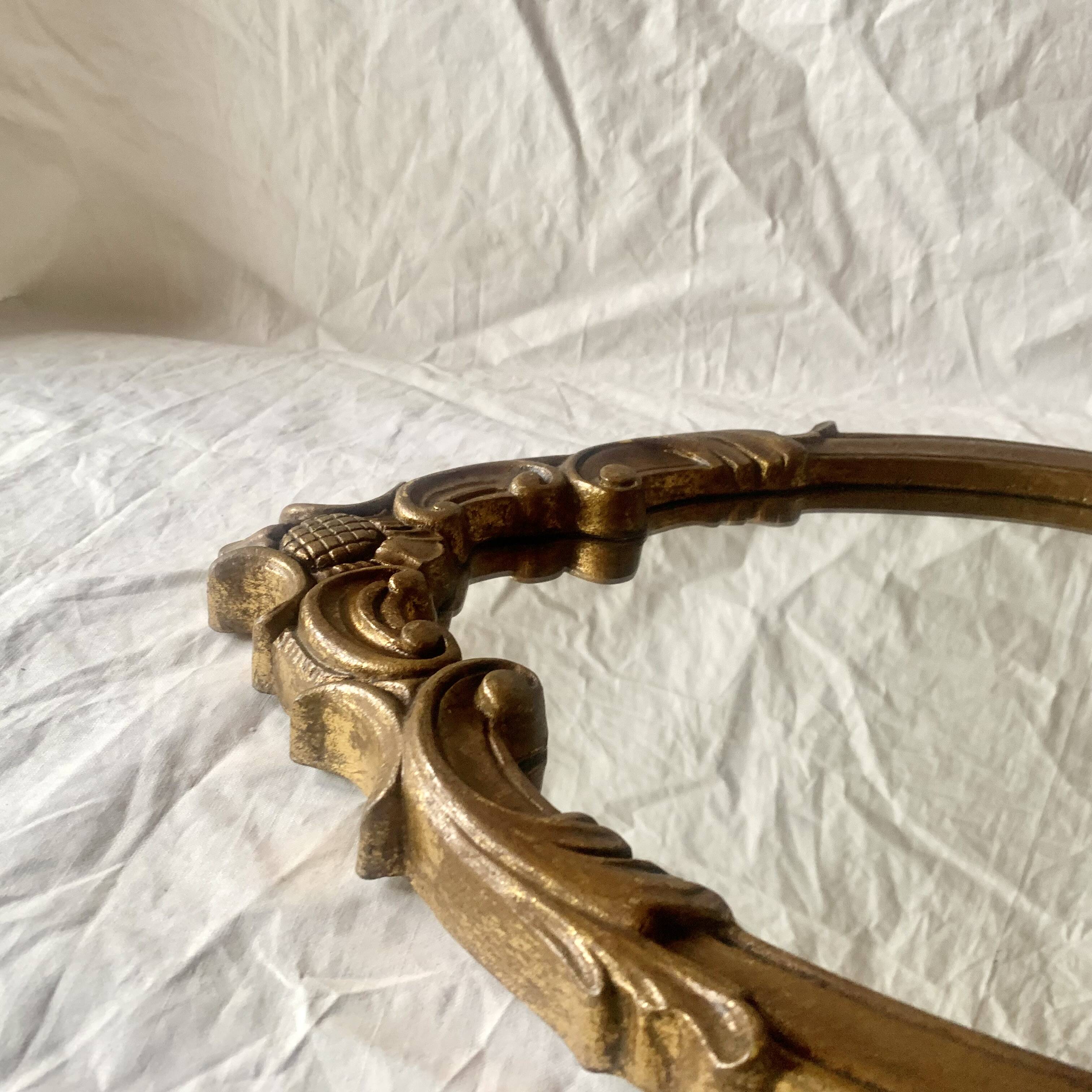 Vintage wall mirror in gold resin