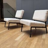 Pair of vintage armchairs, black metal and sheepskin fabric, France 1950.
