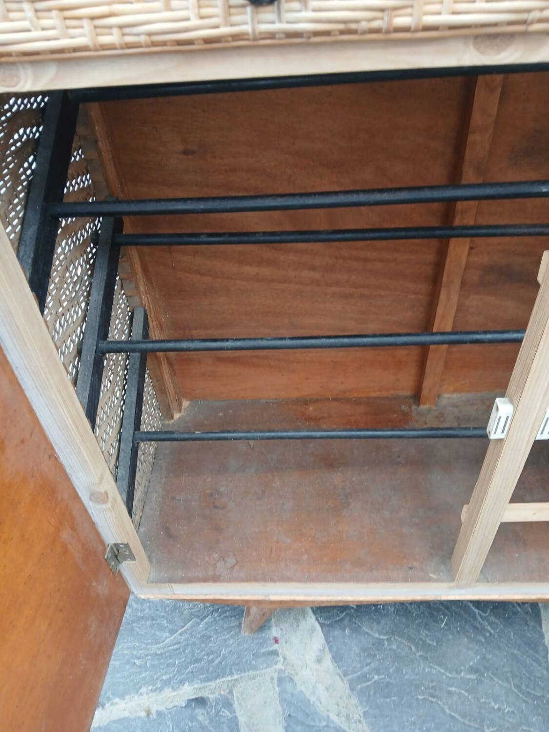 Vintage woven rattan furniture with tapered legs.
