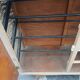 Vintage woven rattan furniture with tapered legs.