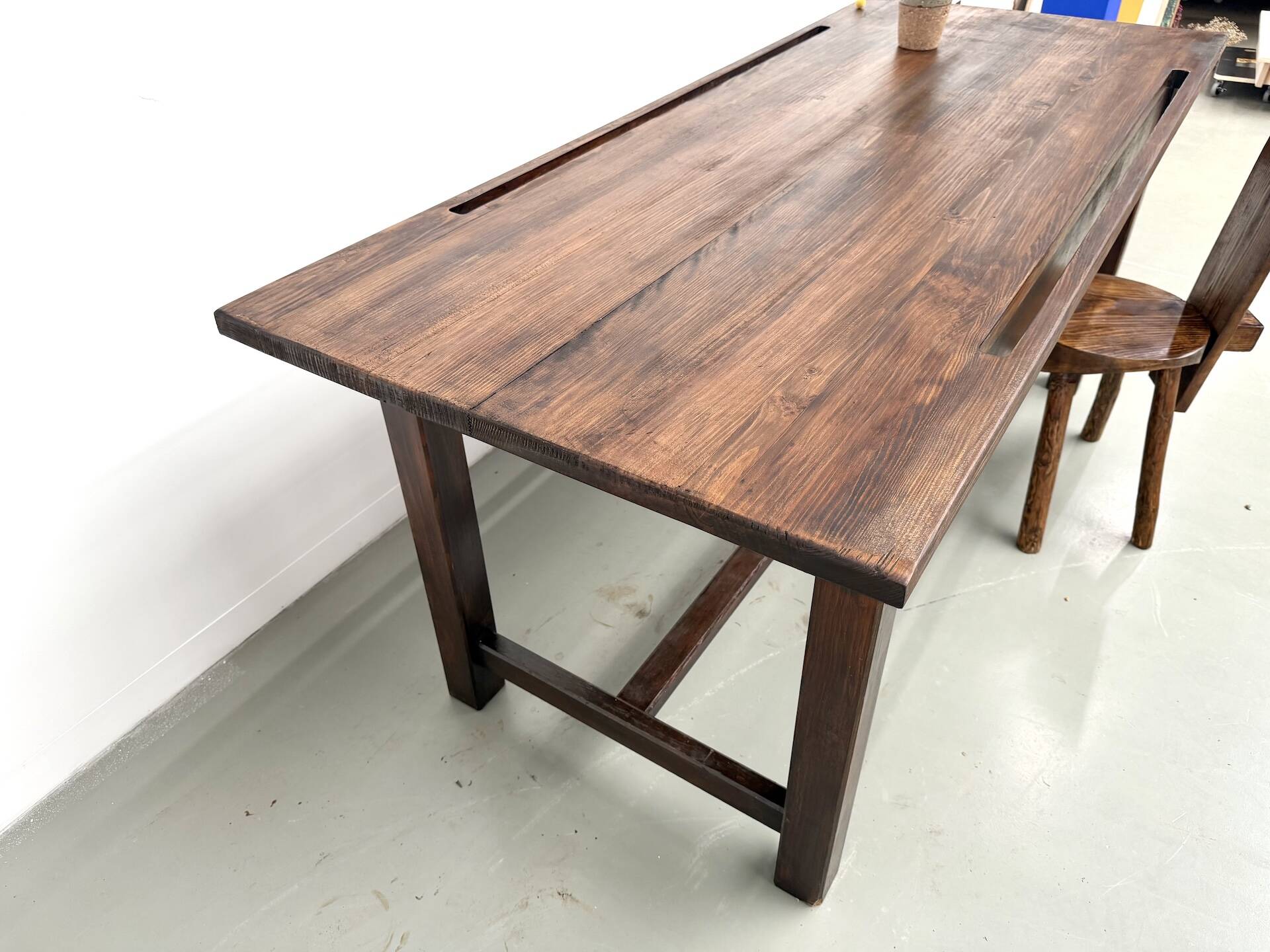 Solid pine workbench, grooved top, satin brown finish.