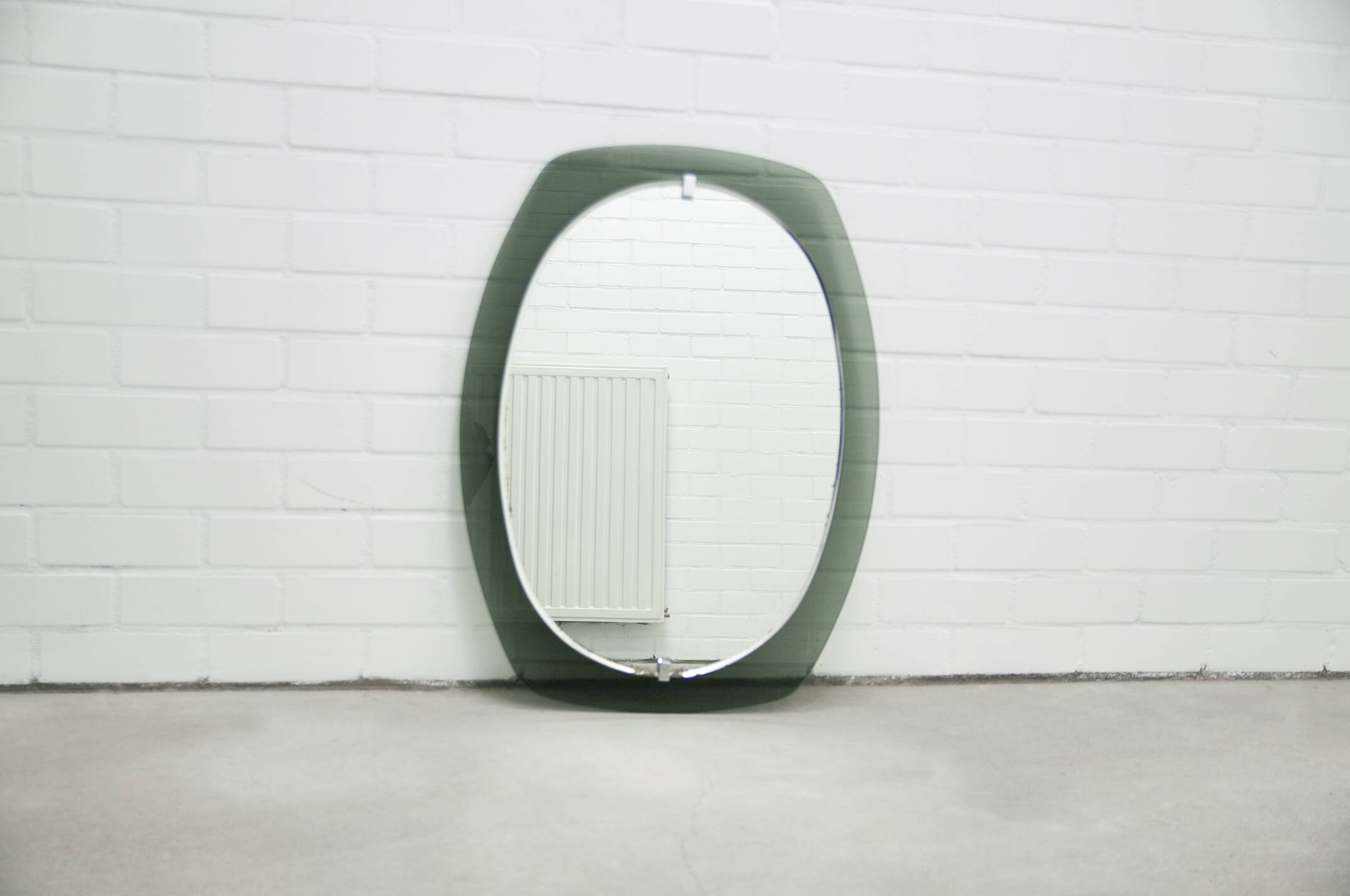Vintage space age large smoked green glass mirror by veca