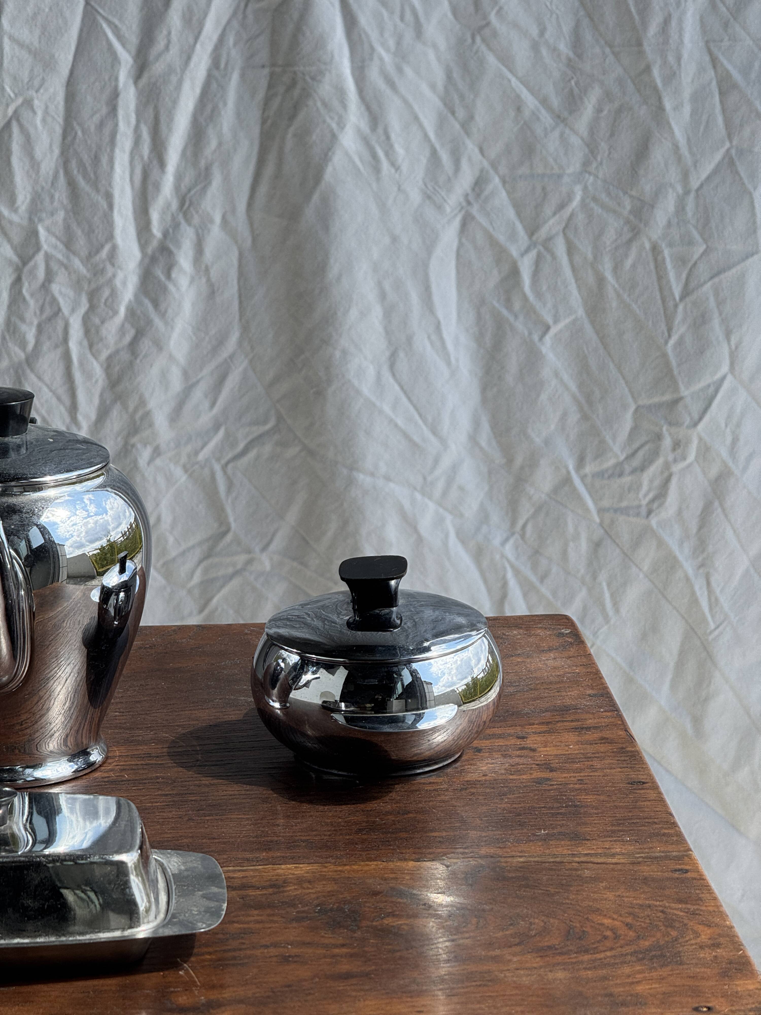 Tea set including teapot, milk jug, sugar bowl and butter dish