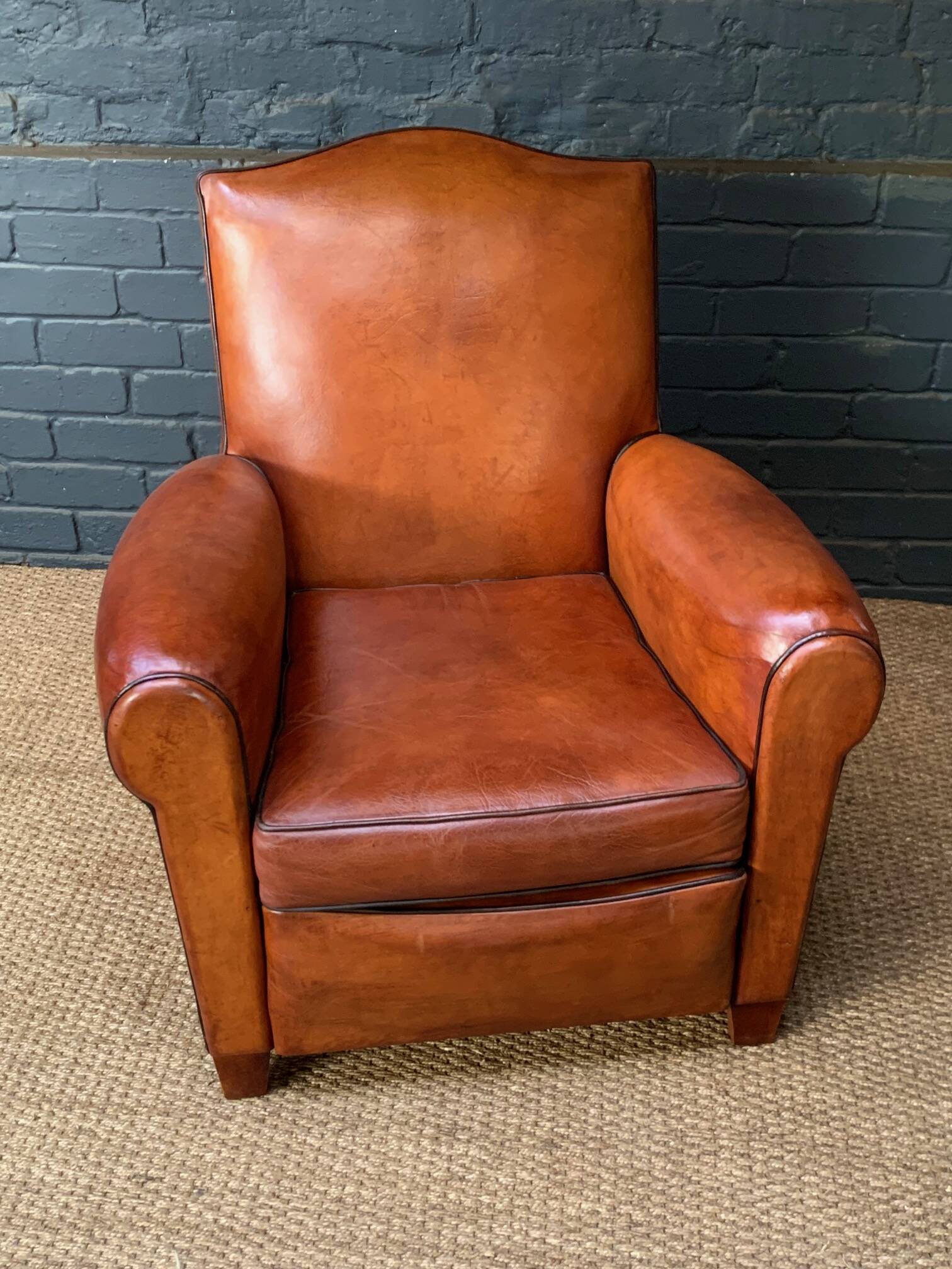 French leather club chair, chapeau de gendarme model circa 1930's in caramel