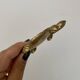 Vintage brass turtle pocket emptier