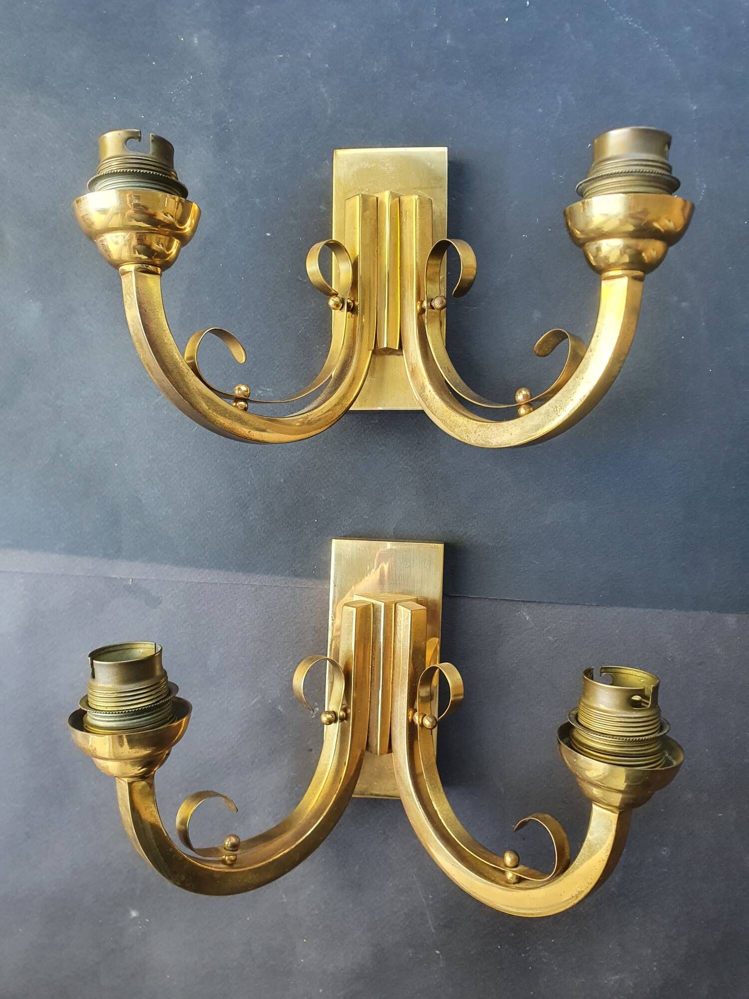 Pair of bronze wall sconces with 1940s Art Deco lampshades.