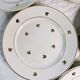 11 plates in antique earthenware decorated with golden leaves and golden border