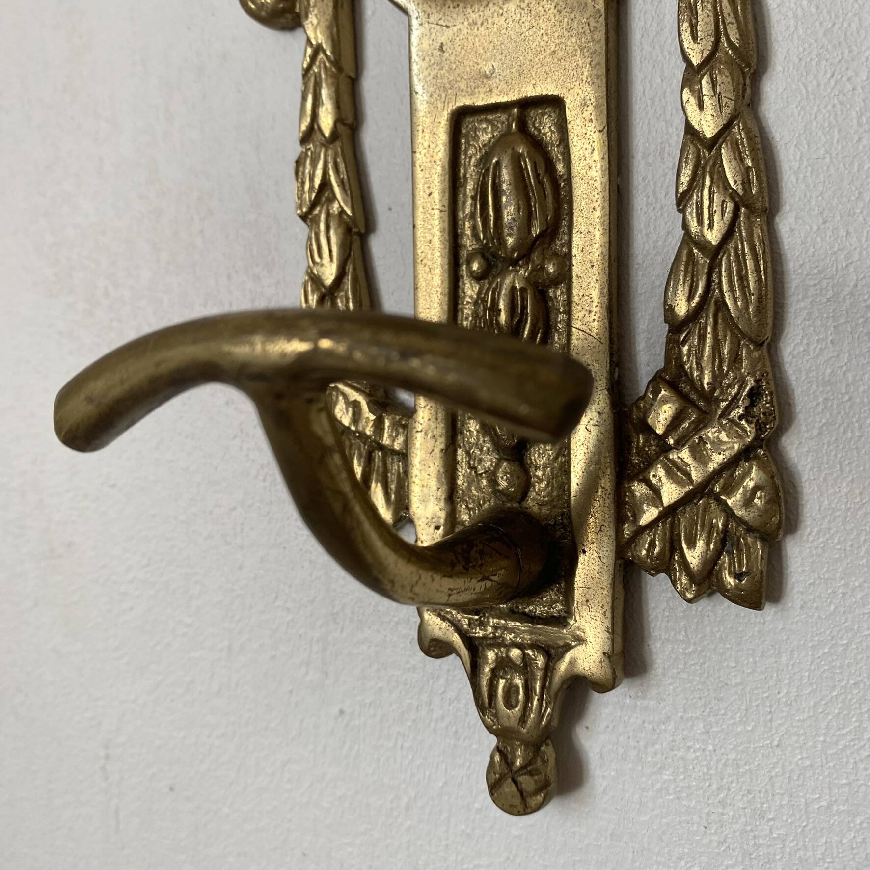 Brass coat hooks in the Napoleon III style.
