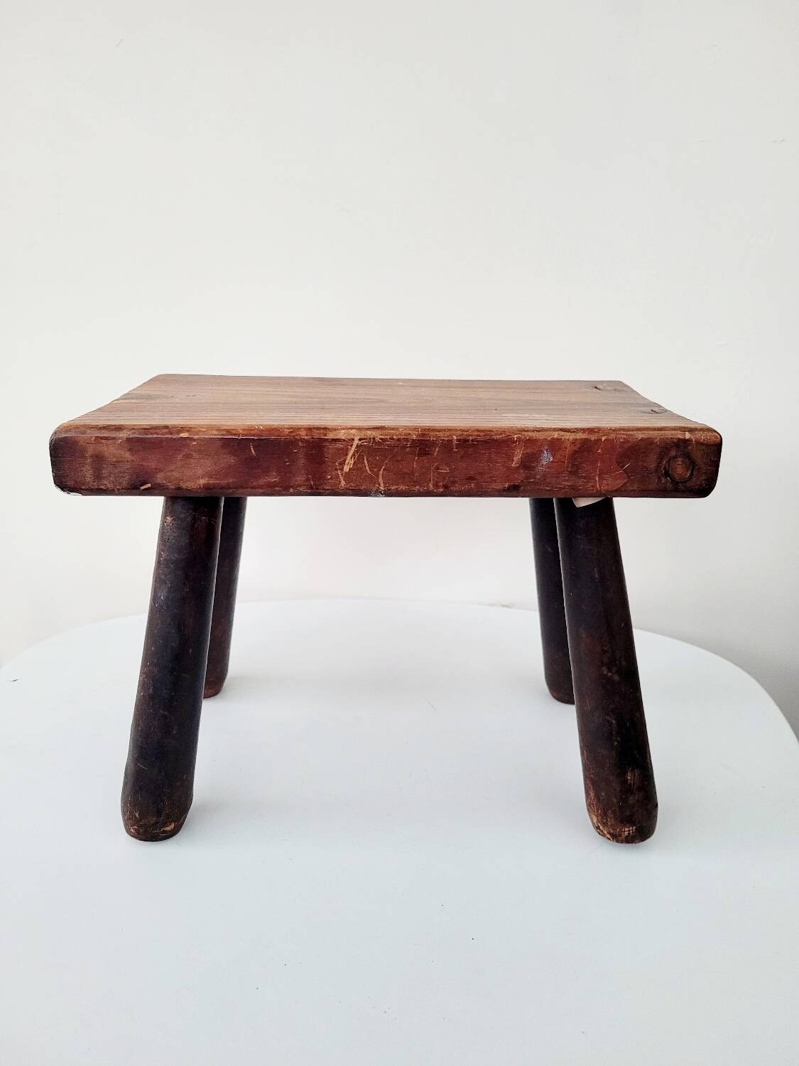 Old small solid wood milking stool