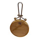 Magnifying brass mirror