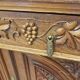 Art Nouveau buffet in carved oak with vine decoration