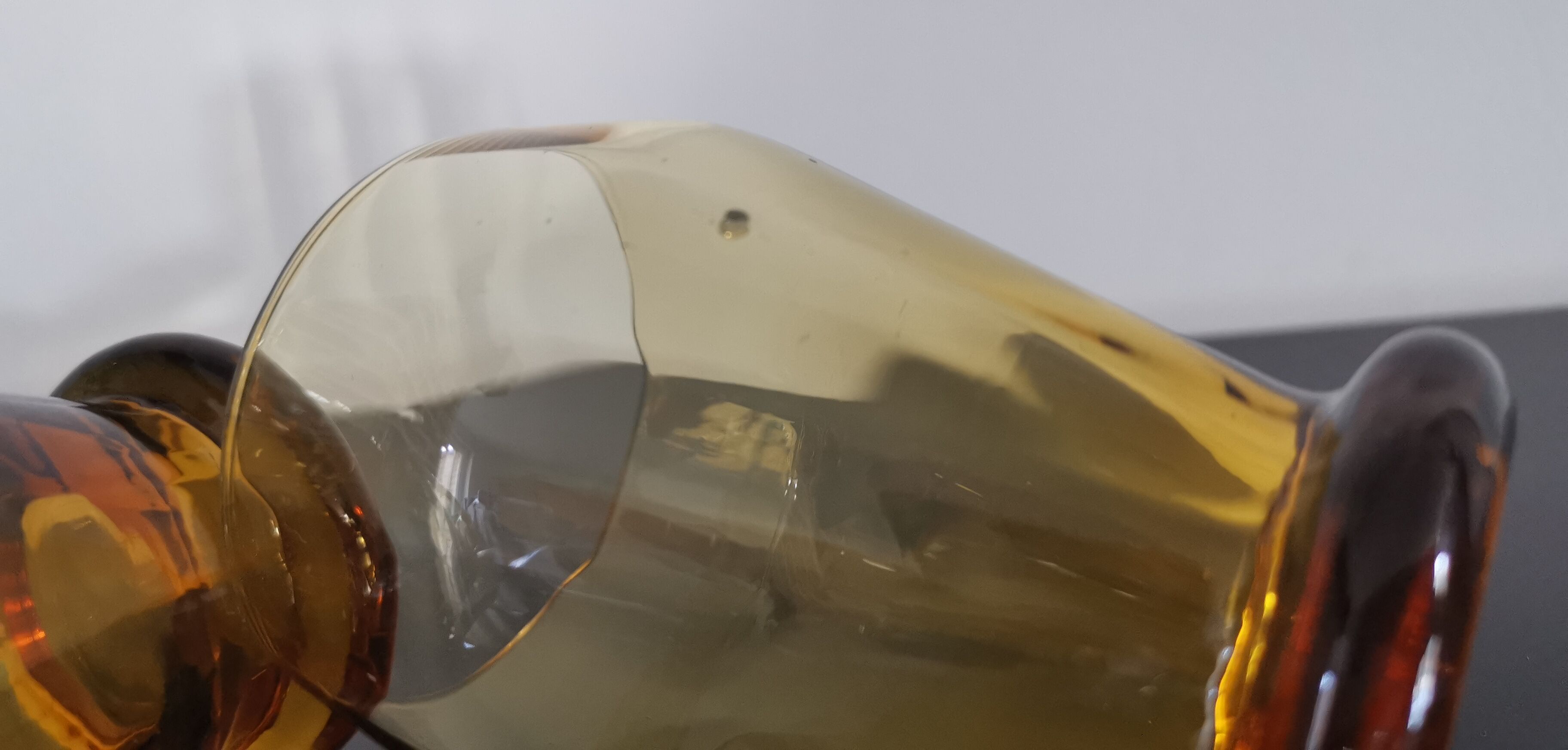 4 old amber colored glasses