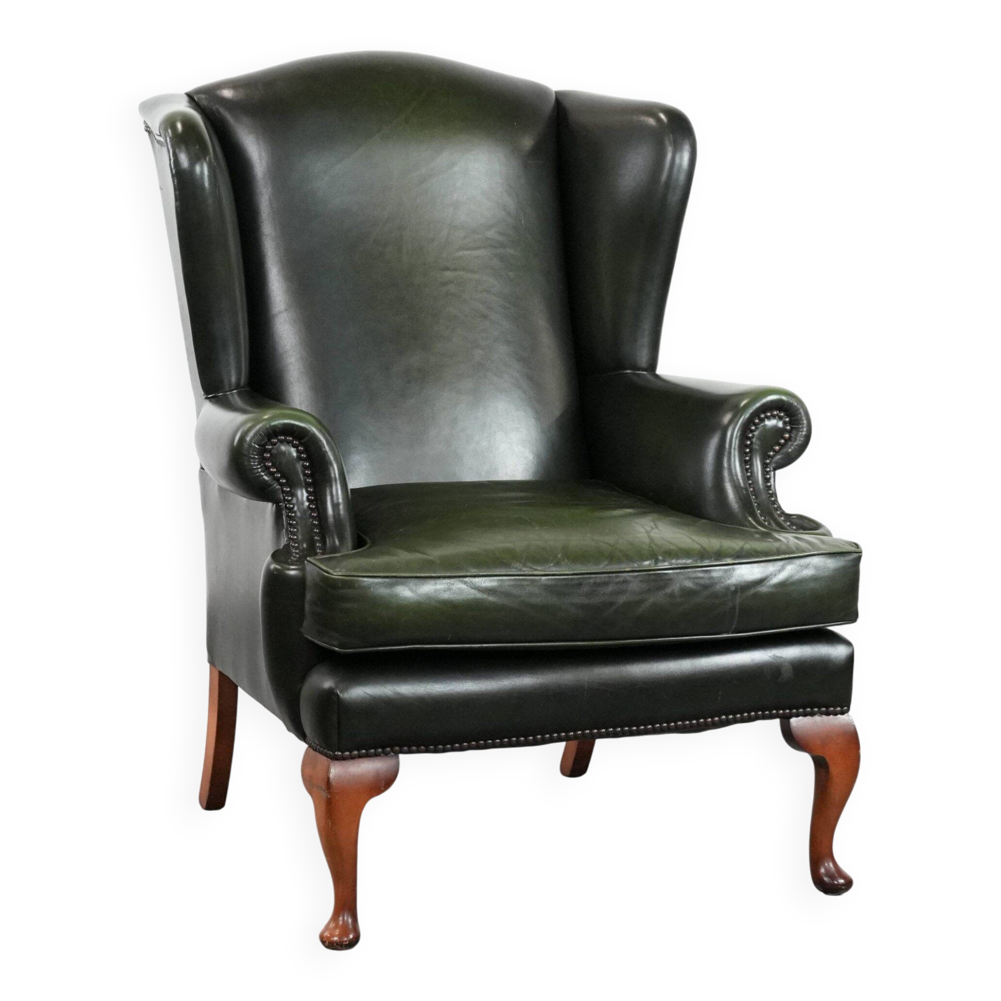 Smooth classic cowhide Chesterfield armchair in a stylish dark green color