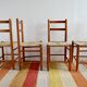 Set of 4 straw chairs and a stool