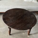 Coffee table, round antique Indonesian teak table with straight legs.