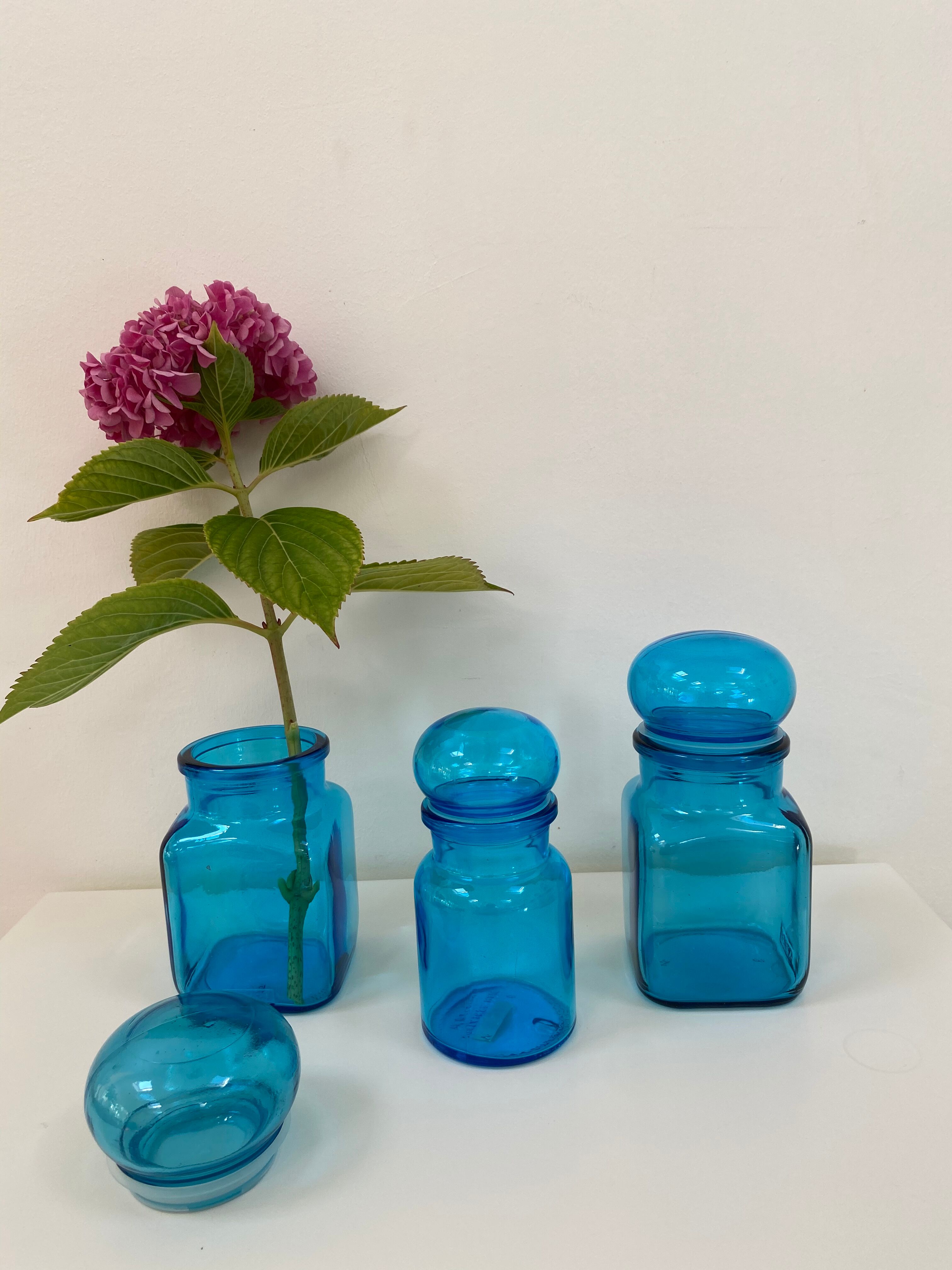 Trio of vintage turquoise blue glass jars