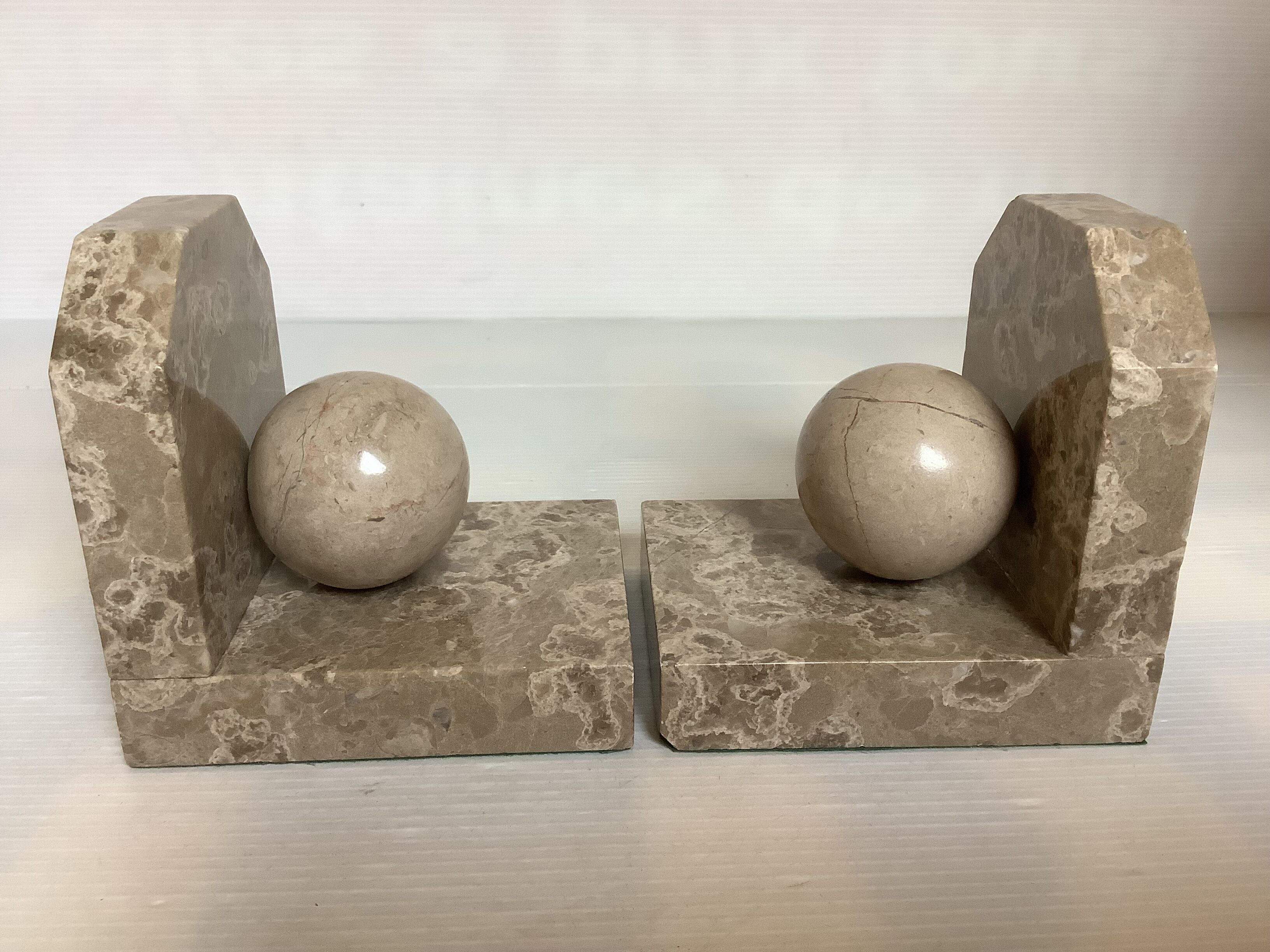 Pair of beige marble bookends.