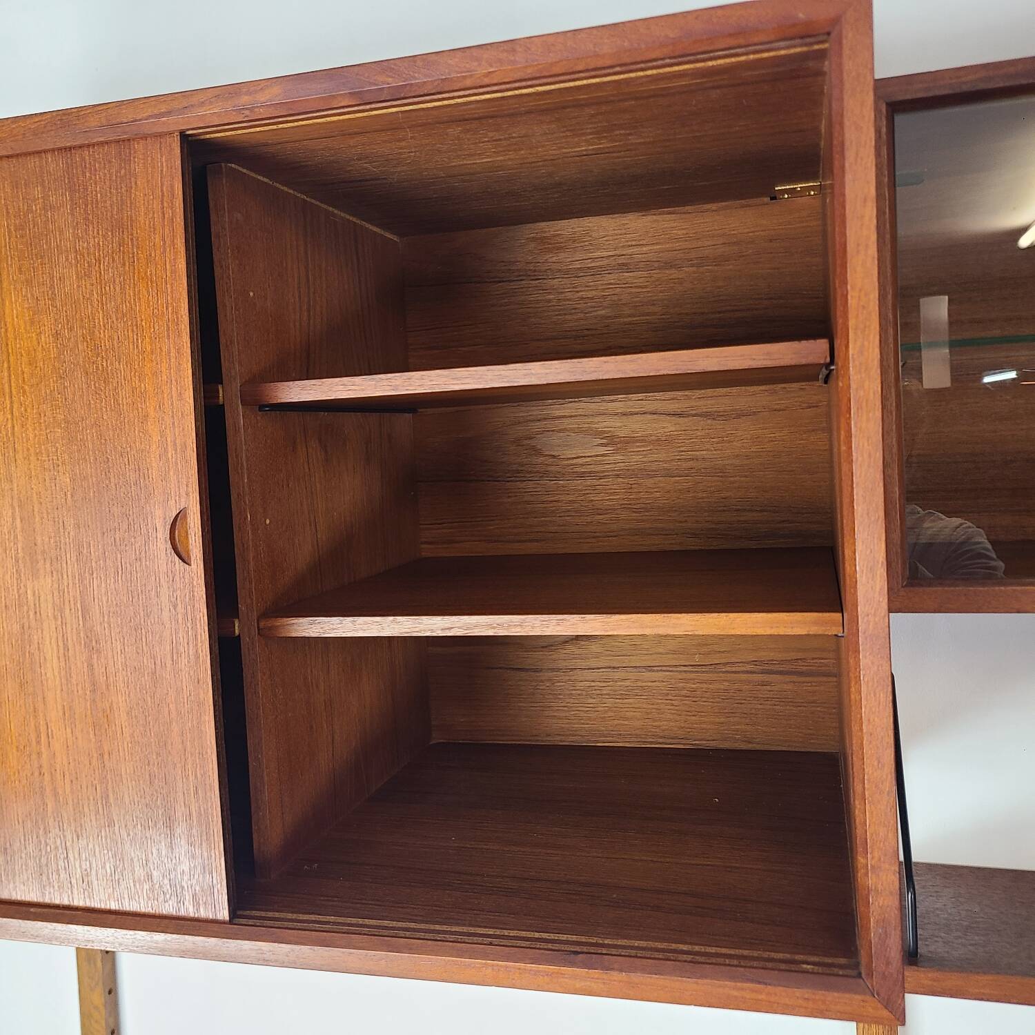 Danish wall-mounted bookshelf designed by Poul Cadovius, Scandinavian design.