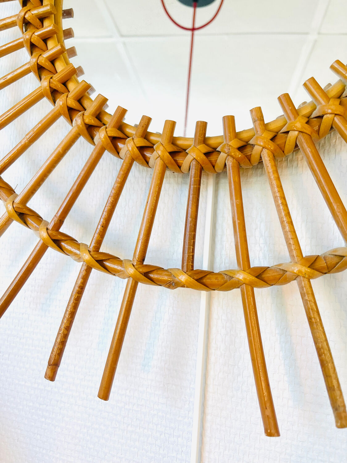 Vintage sun mirror in woven rattan – 60s/70s