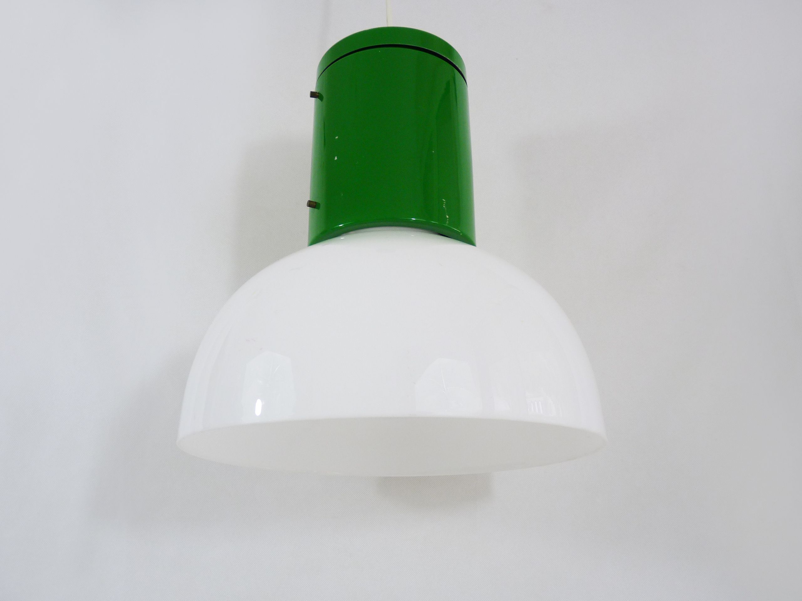 Vintage industrial suspension in green metal and white plastic lampshade. Year 70