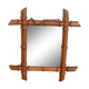 Old wooden mirror, carved bamboo way