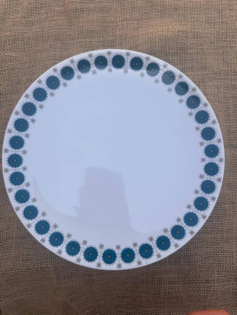 Vintage Thomas Germany flat plates, geometric blue rosette design.