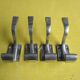 Set of four aluminium coat hooks from the 1950s.